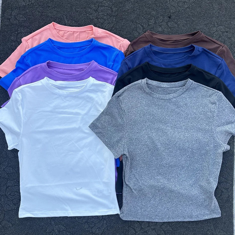 Solid color women's soft breathable yoga short-sleeved comprehensive training tight T-shirt with exposed belly button fitness sh